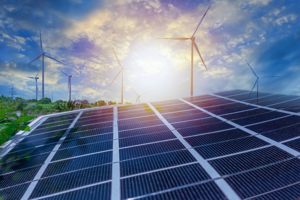Image shows Renewable energy resources solar panels and wind turbines installed for a project by DOAS Token